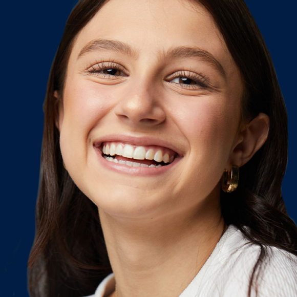 smiling teen wearing invisalign aligners