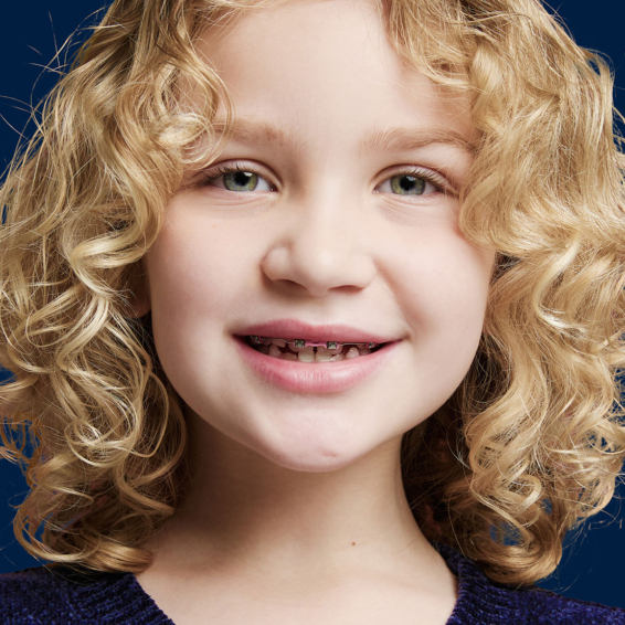 child with metal braces